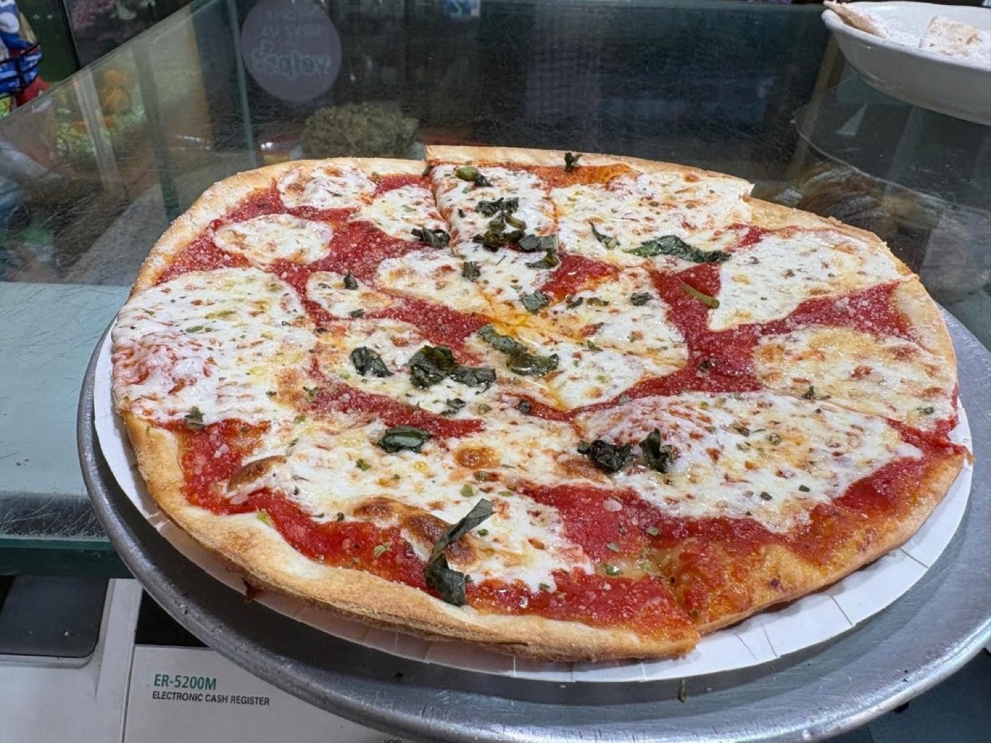 Margherita pizza with melted mozzarella, tomato sauce, and basil at Casa Mia in Sparta.
